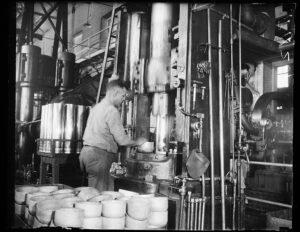 Historic U.S. factory production building illustrating manufacturing activity and factory orders