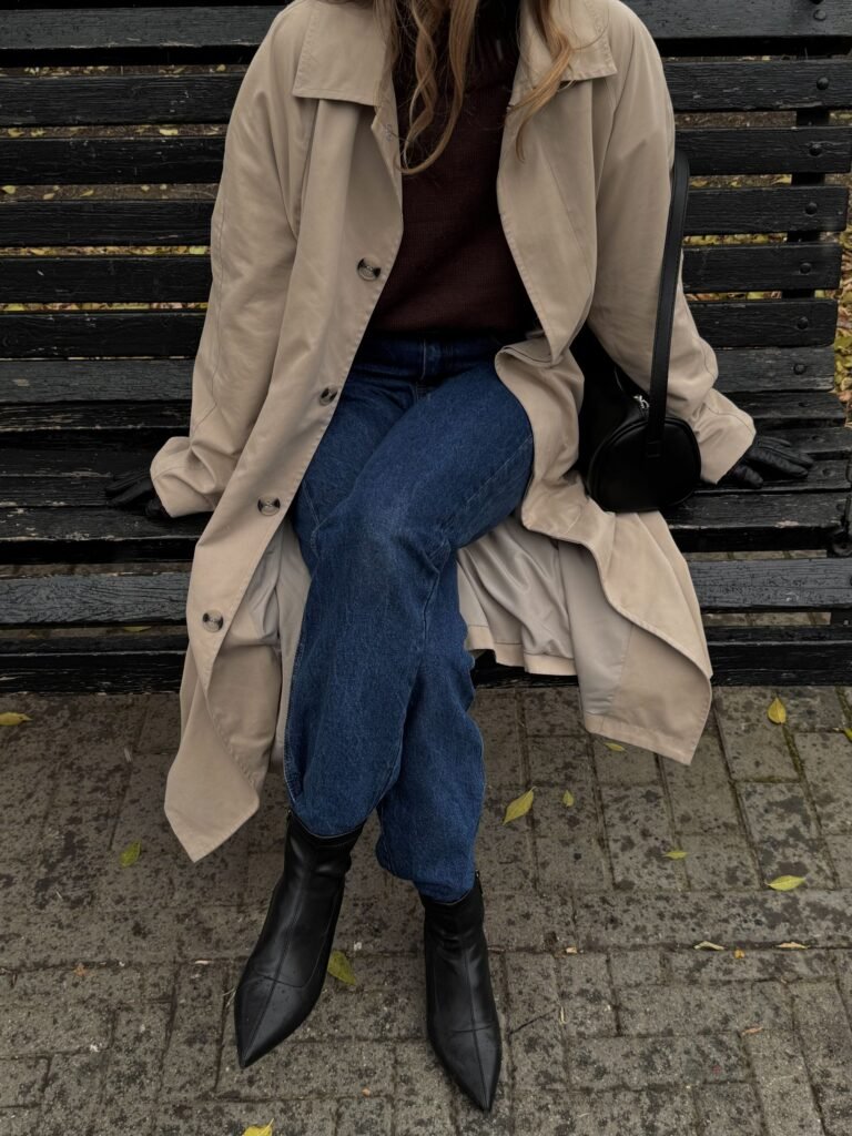 Woman wearing a stylish autumn outfit in a city park