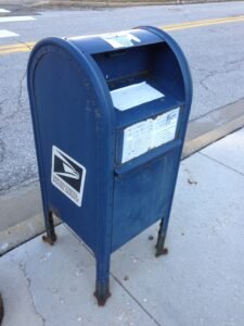 Blue United States Postal Service mailbox for outgoing mail