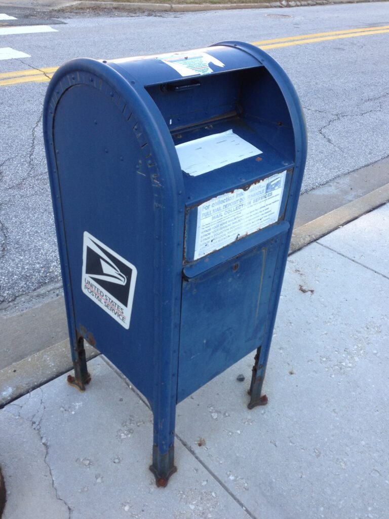 Blue United States Postal Service mailbox for outgoing mail