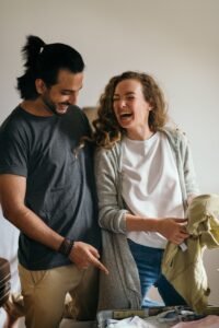 Couple packing suitcases at home before a holiday journey
