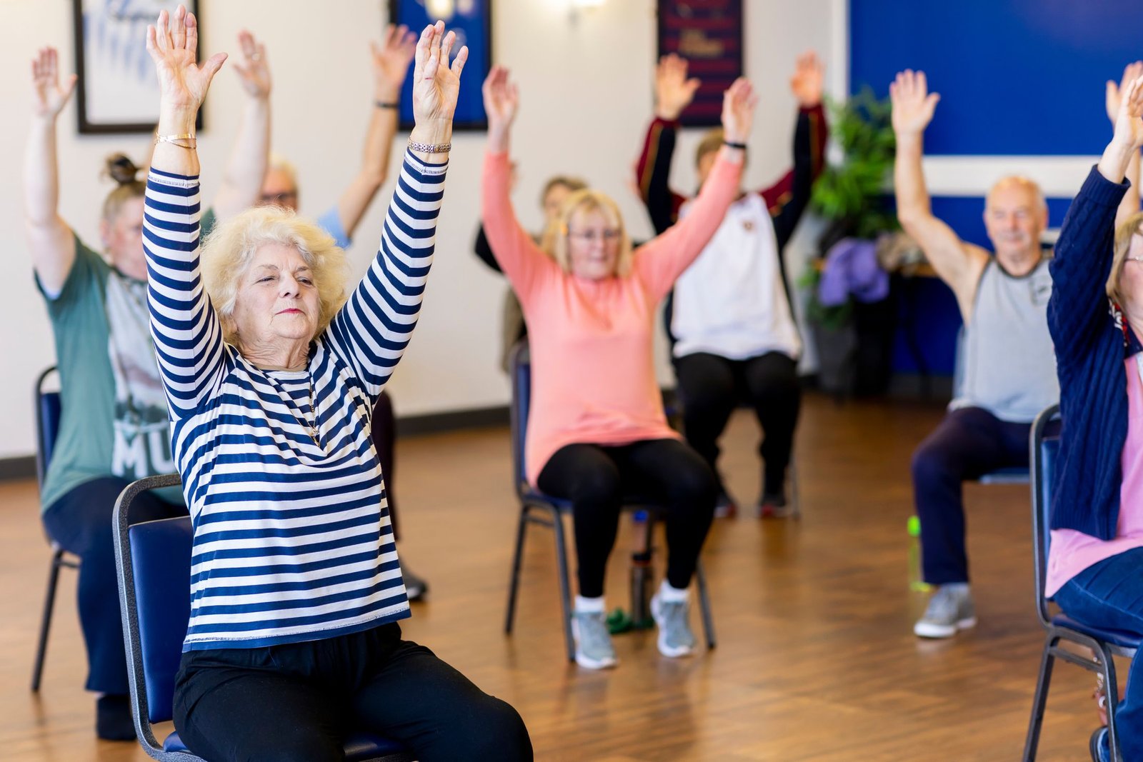 Older adults taking part in a group fitness class