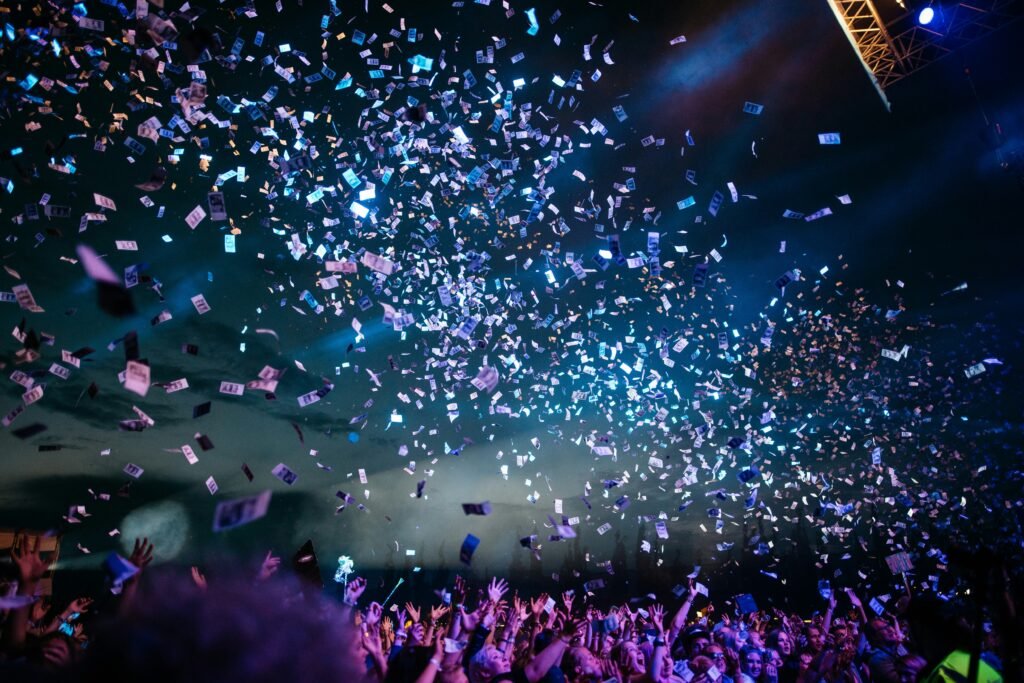 Crowd and stage lights representing Hollywood film events and entertainment industry activity