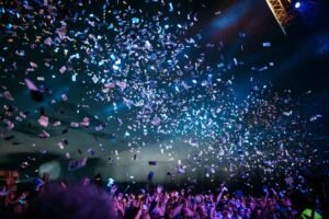 Crowd and stage lights representing Hollywood film events and entertainment industry activity