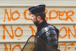 Police officer in protective equipment during a public safety operation