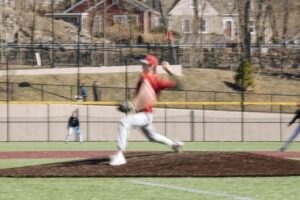 Baseball pitcher throwing from the mound