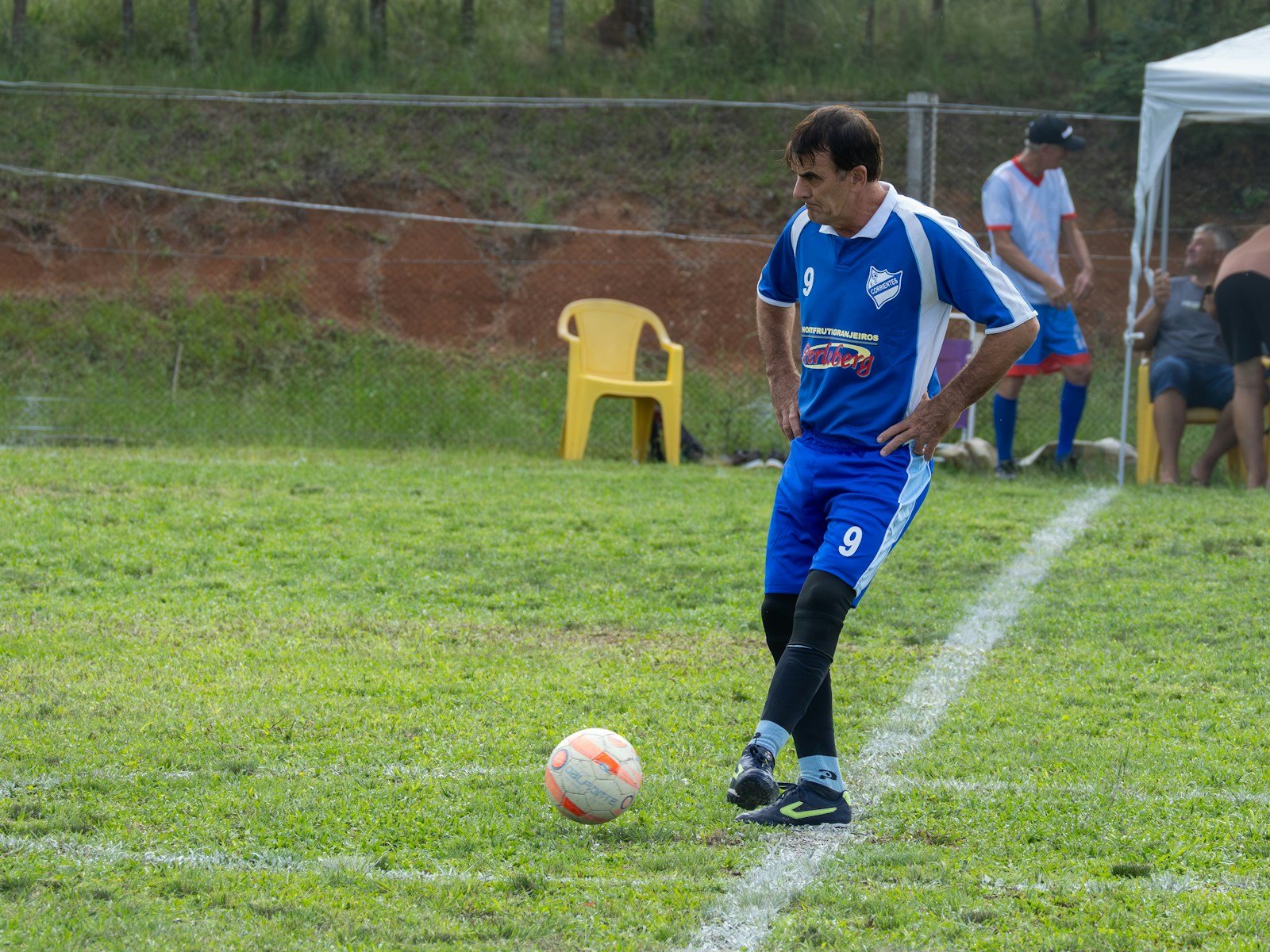Soccer player controlling the ball on a field