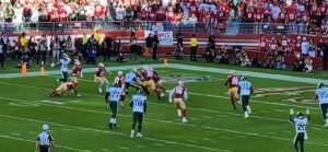 American football game in a stadium