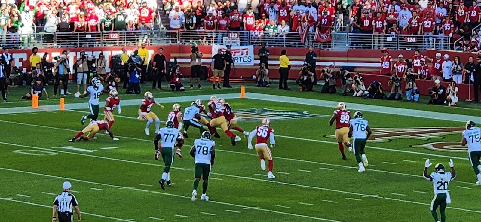 American football game in a stadium