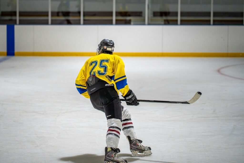 Hockey player skating on an ice rink