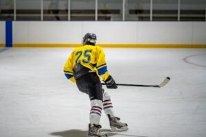 Hockey player skating on an ice rink
