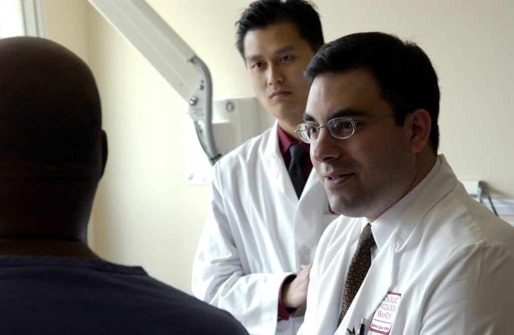 Medical professionals consulting with a patient in a hospital setting