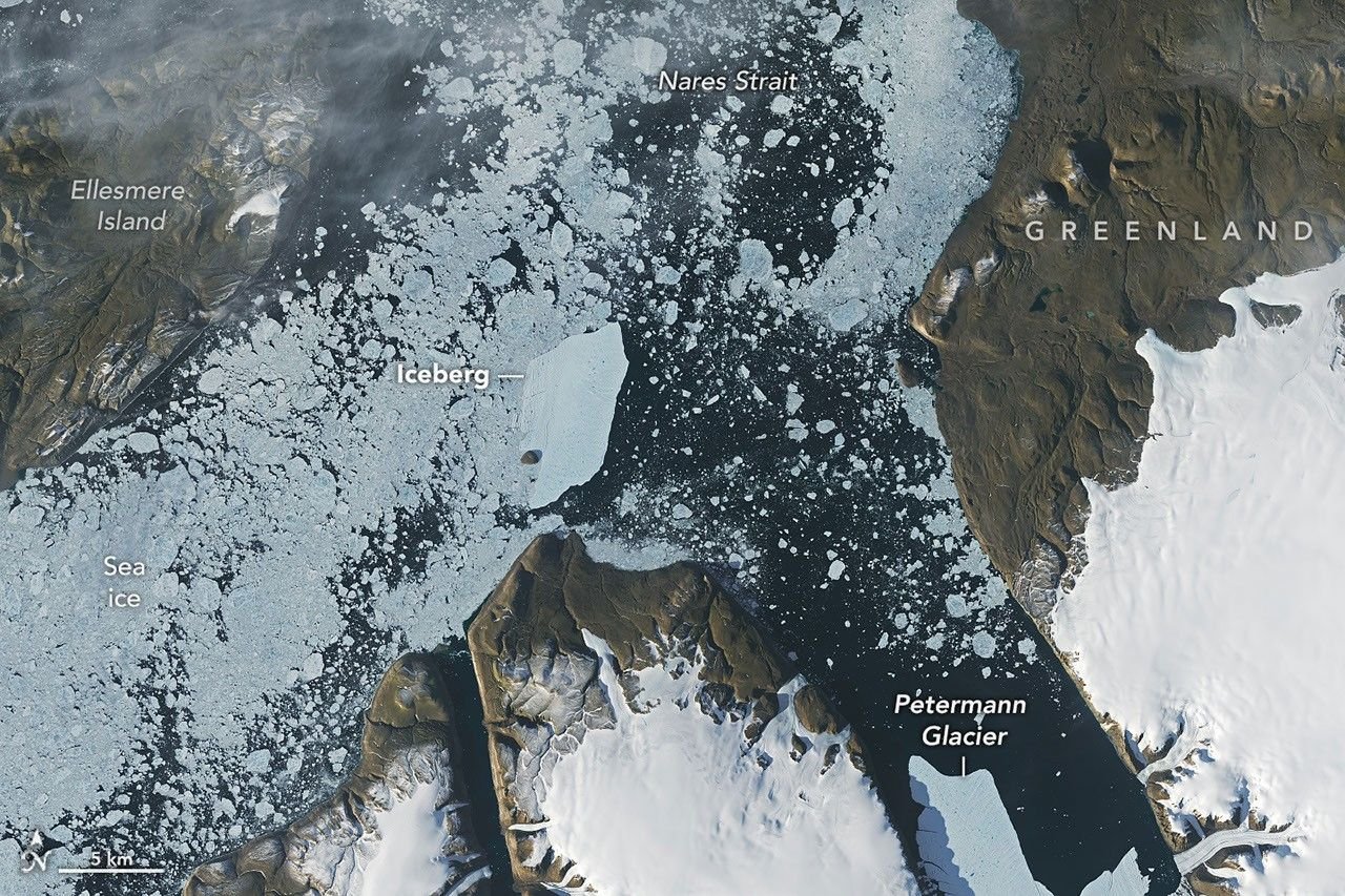 Landsat 9 satellite image showing an iceberg from Petermann Glacier near Joe Island in Greenland